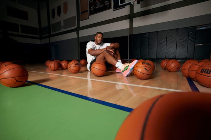 Scoot Henderson modeling his peach and green PUMA sneakers.